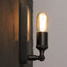 Industrial Charm For Your Dining Room: The Black Wall Lamp With Exposed Bulb