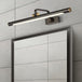 Modern Elegance Meets Warmth: Black Tubular Bathroom Vanity Light