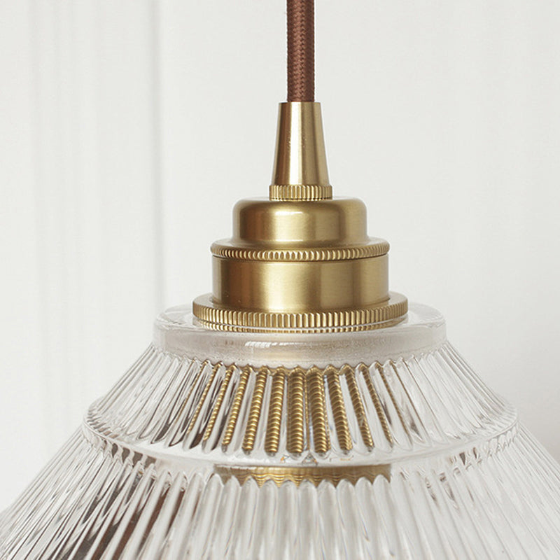 Enhance Your Dining Room With Industrial Elegance: The Brass Cone Pendant Clear Ribbed Glass