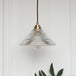 Enhance Your Dining Room With Industrial Elegance: The Brass Cone Pendant Clear Ribbed Glass