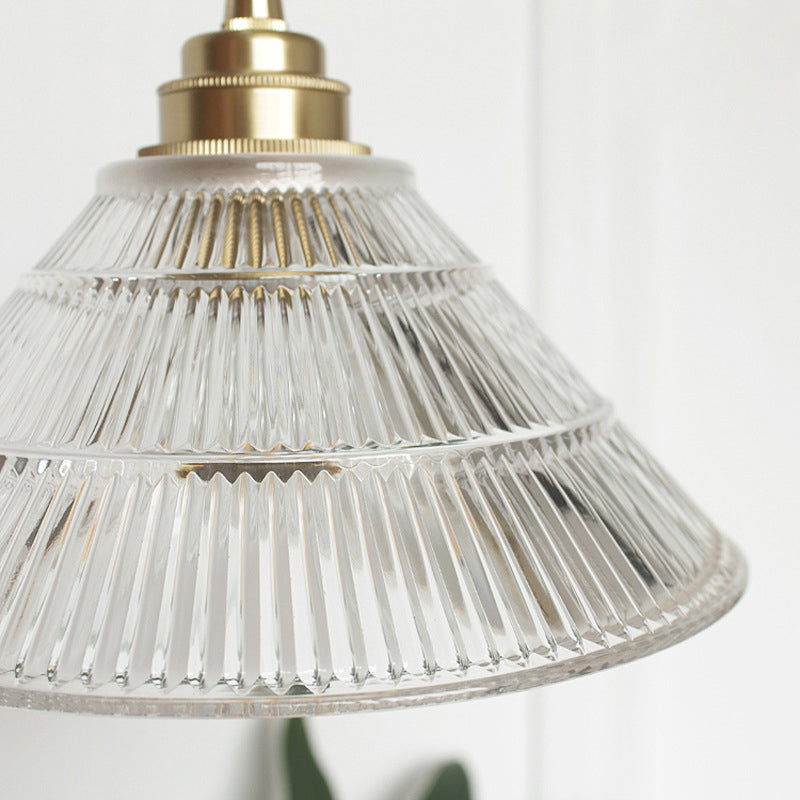 Enhance Your Dining Room With Industrial Elegance: The Brass Cone Pendant Clear Ribbed Glass