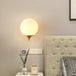 Modern Elegance Meets Warmth: Gold Sphere Bedside Wall Sconce