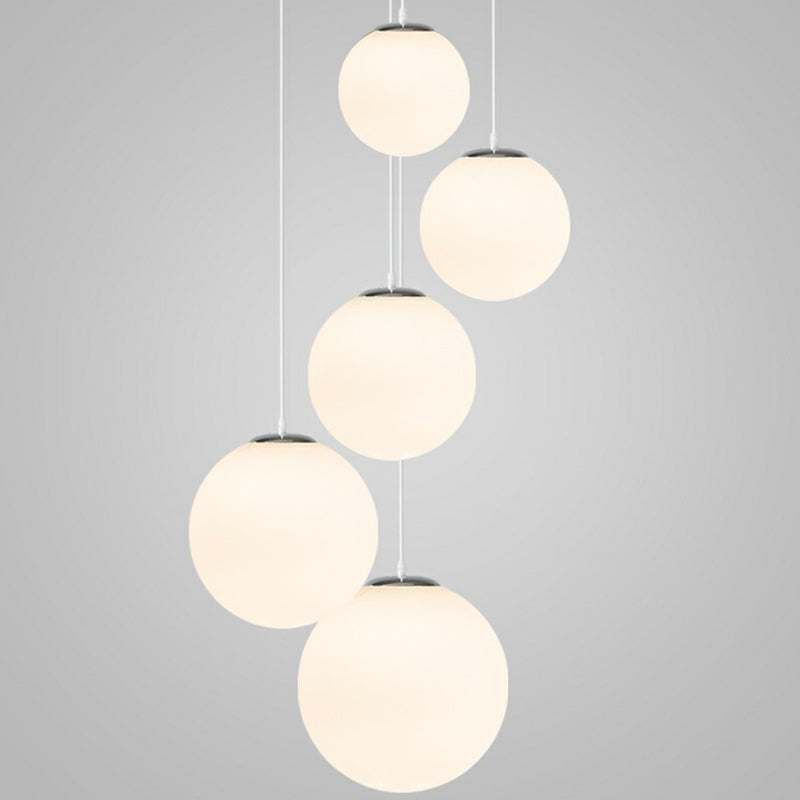 Makayla Elegance Meets Versatility: White Glass Globe Pendant