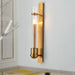 Modern Elegance Meets Warm Illumination: The Clear Glass Wall Sconce Brass