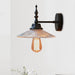 Light Up Your Space With Industrial Chic: The 1 - Light Black Sconce Clear/Green Glass