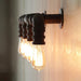 Embrace Industrial Charm And Ample Illumination: The 4 - Bulb Linear Pipe Wall Sconce Black Wall