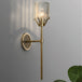 Olivia’s Luminous Embrace: Modern Crystal Wall Sconce