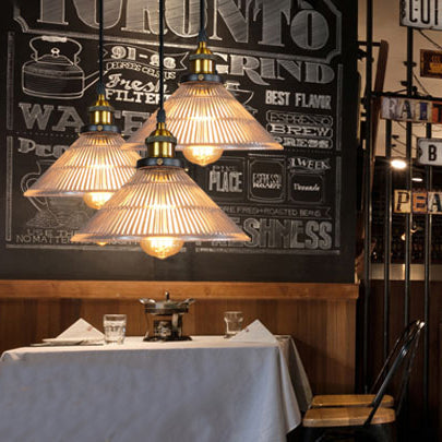 Illuminate Your Dining Room With Industrial Elegance: The 3 - Light Brass Cone Pendant Ribbed Glass