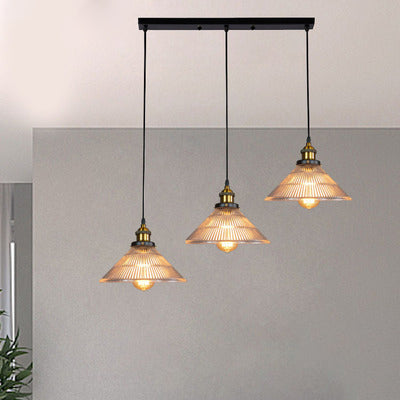 Illuminate Your Dining Room With Industrial Elegance: The 3 - Light Brass Cone Pendant Ribbed Glass